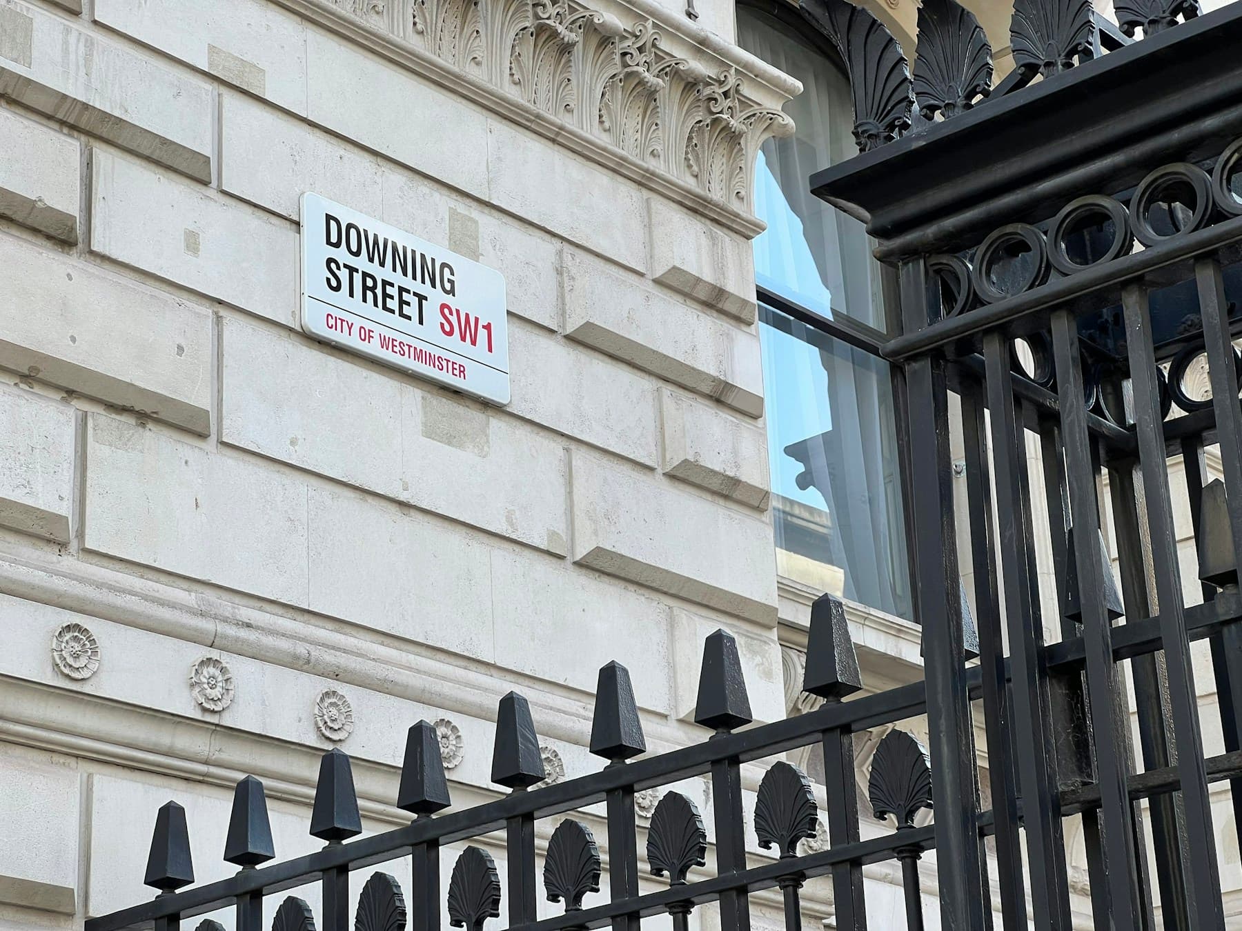 The Downing Street sign on a building in Westminster