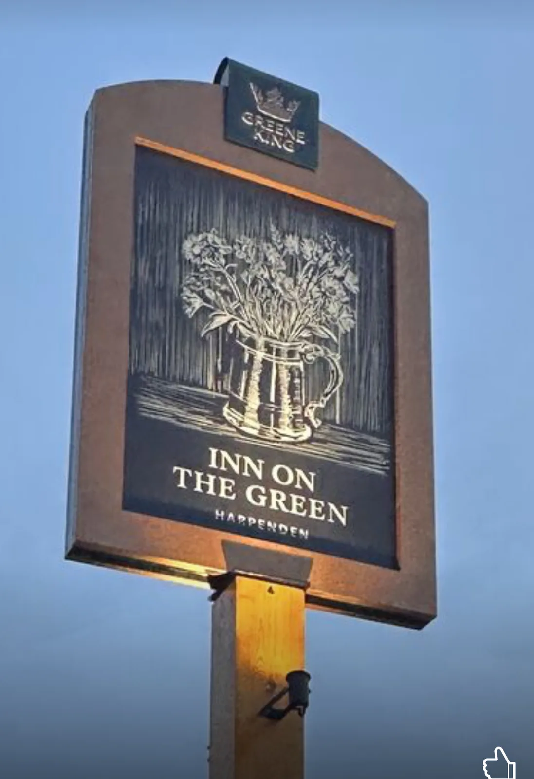 Inn on the Green pub sign with a detailed botanical illustration