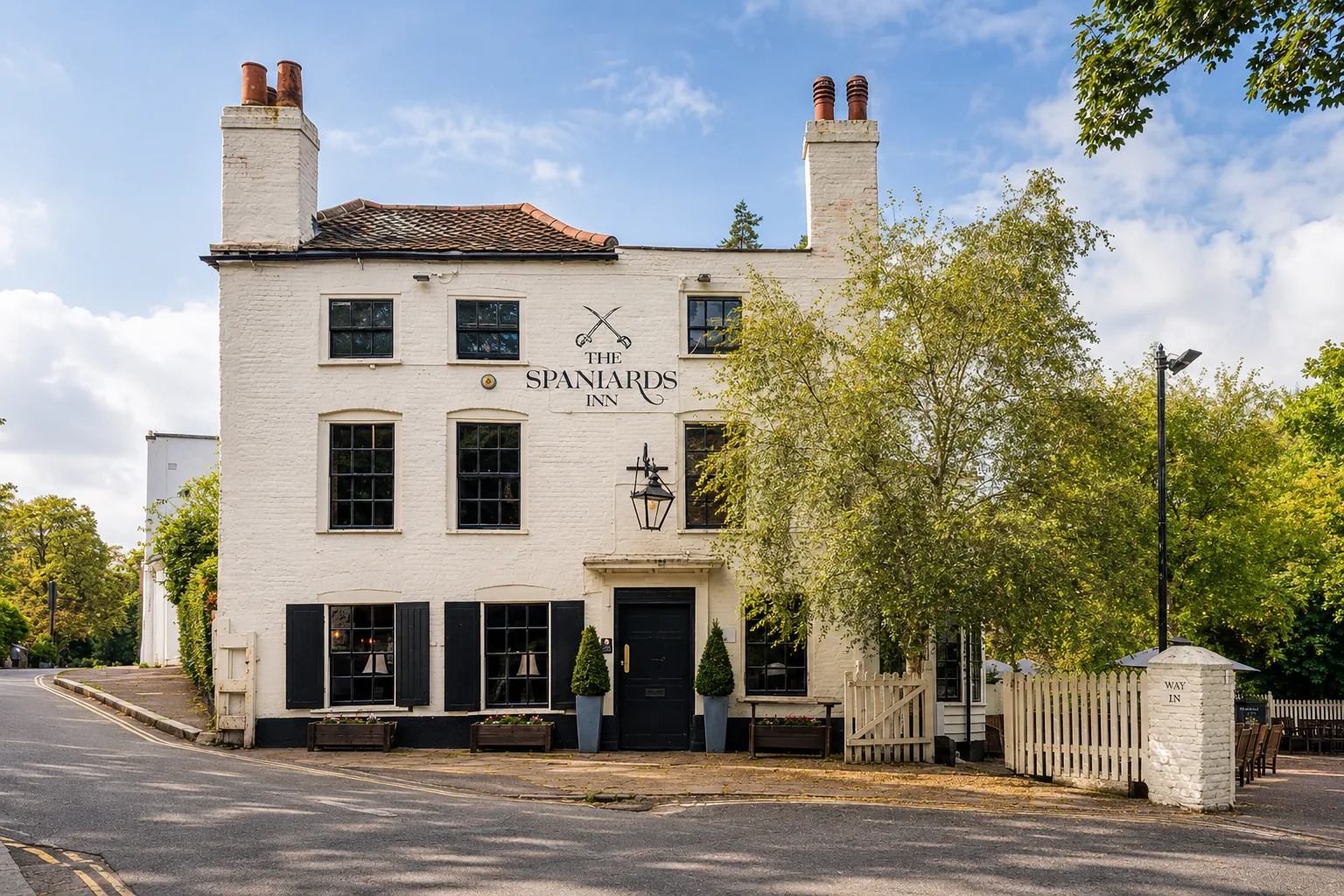 The white-painted Spaniards Inn beside Hampstead Heath