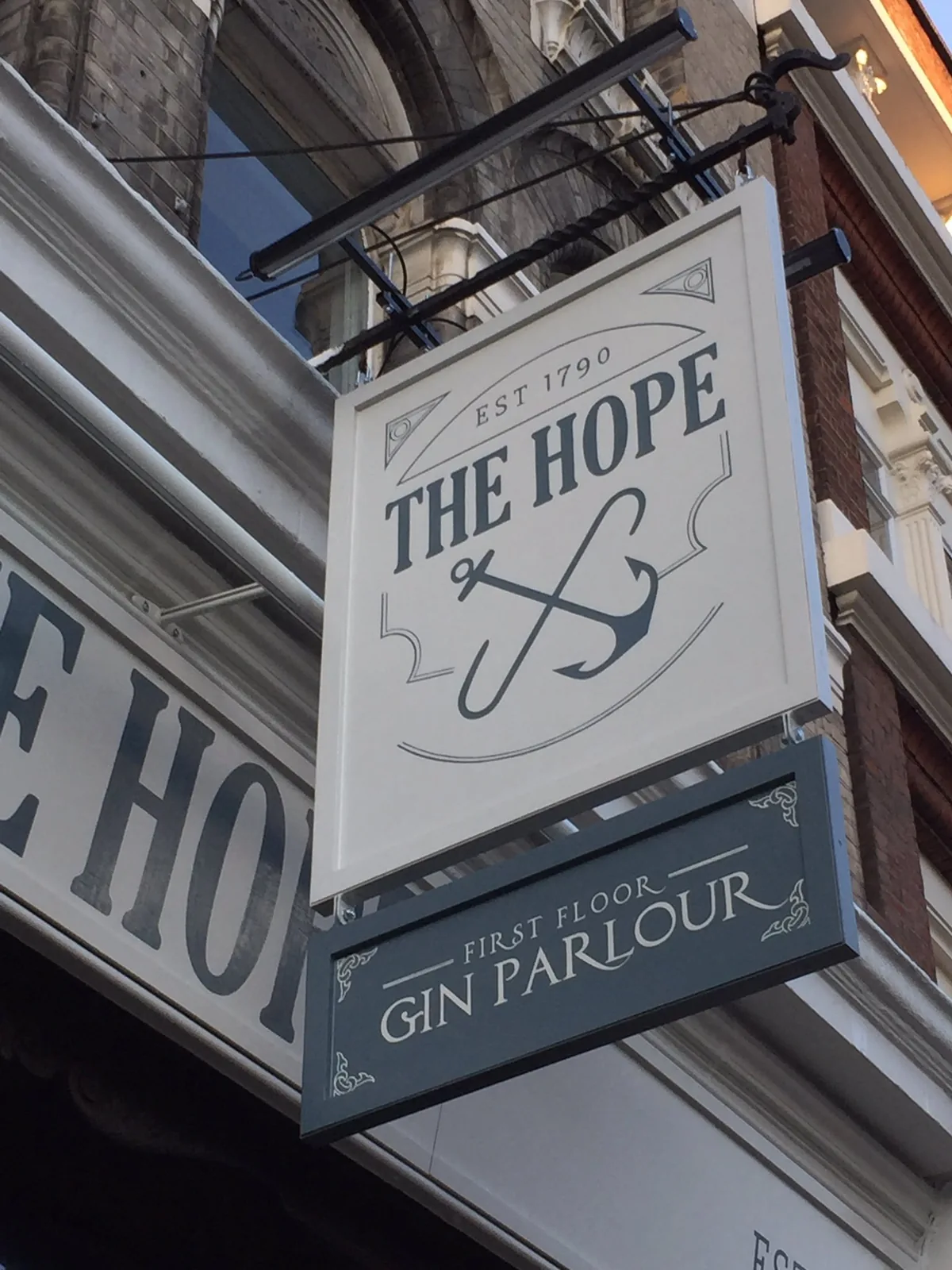 The Hope pub sign in Smithfield with decorative script lettering